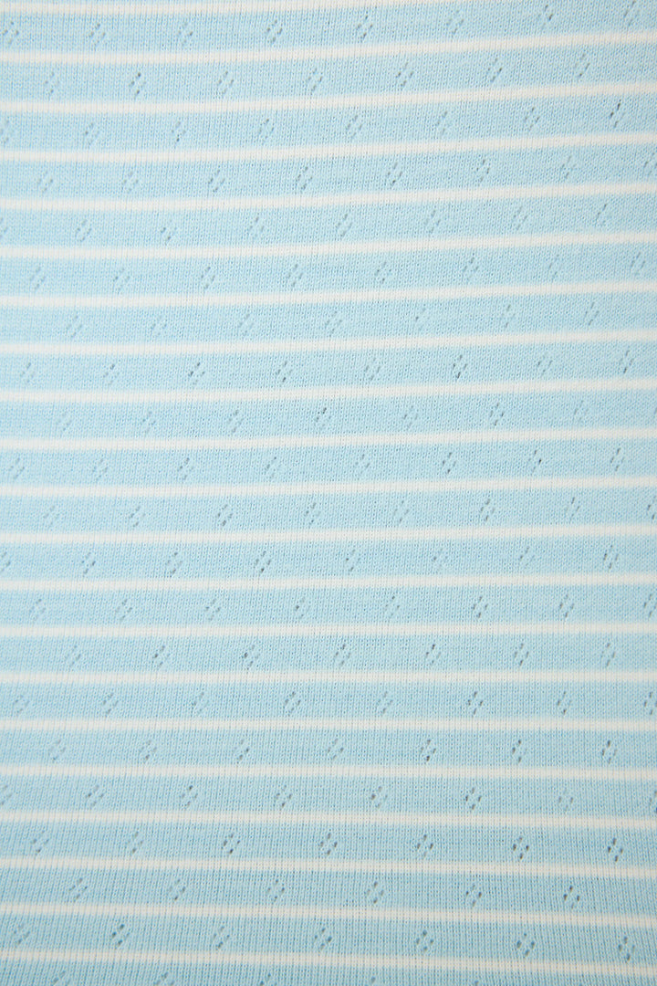 Textured blue fabric with thin white stripes