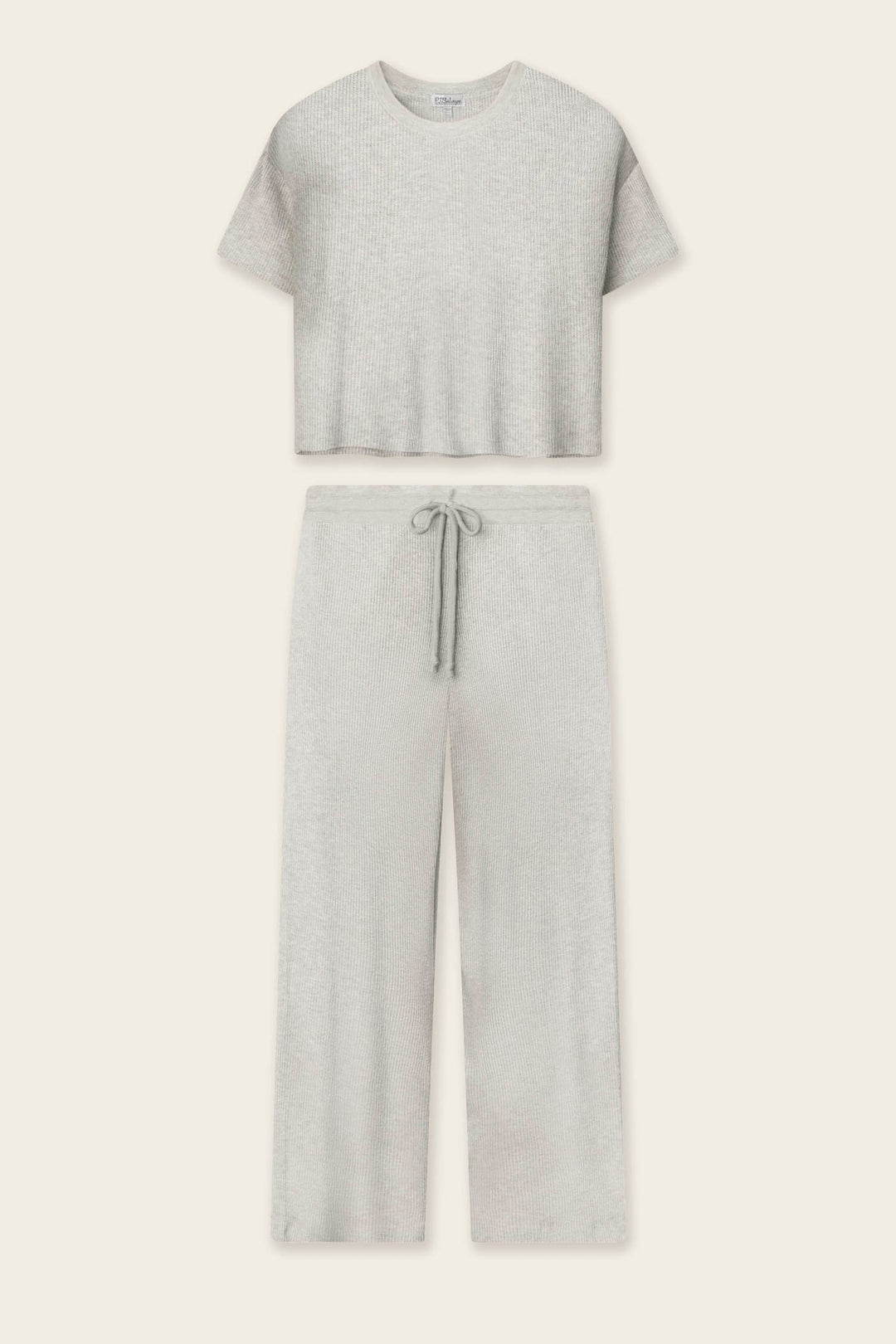 A light heather gray two-piece loungewear set consisting of a short-sleeve cropped t-shirt and matching wide-leg drawstring pants, laid flat against a light cream background.