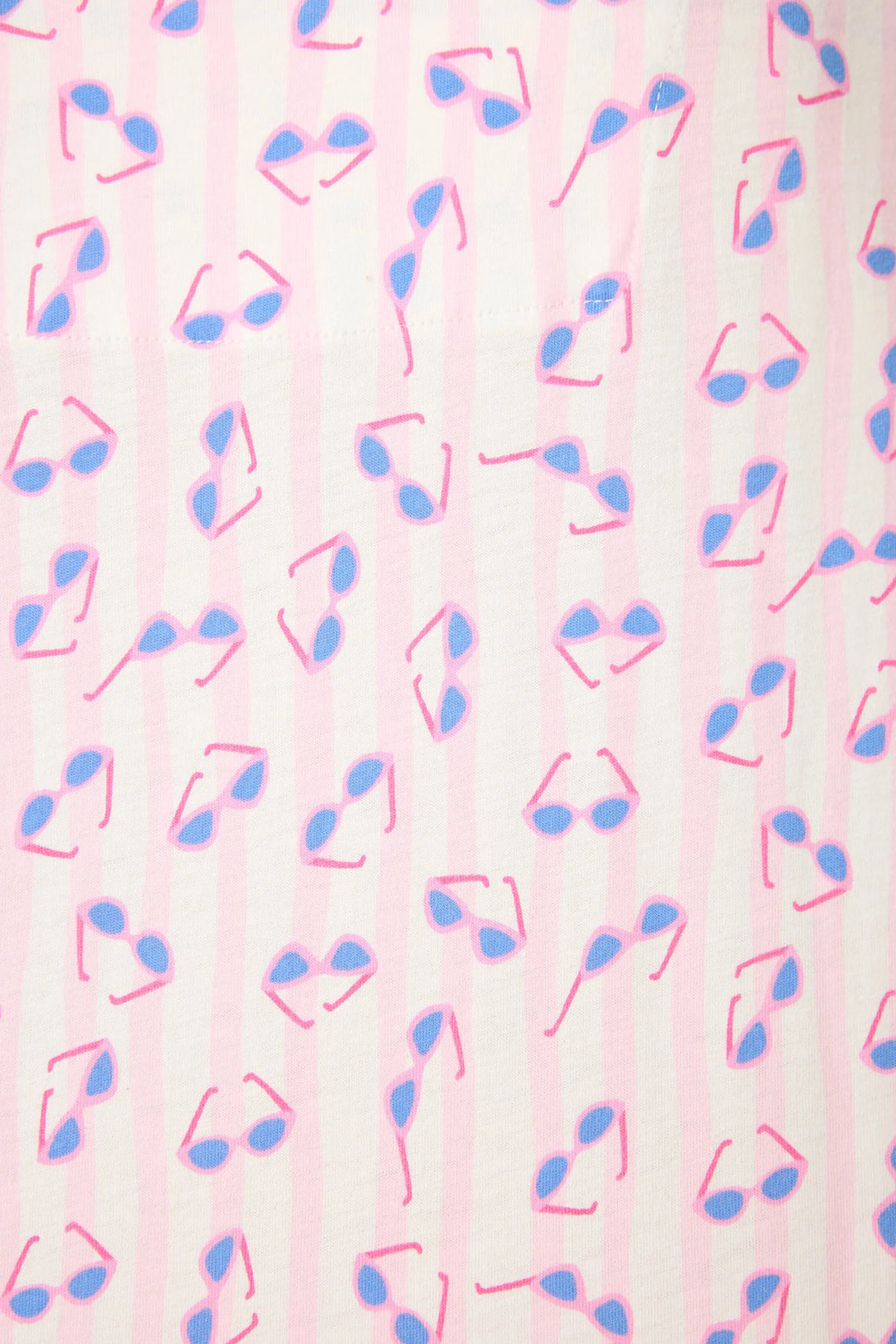 Pattern of pink and blue sunglasses on a light pink stripe background
