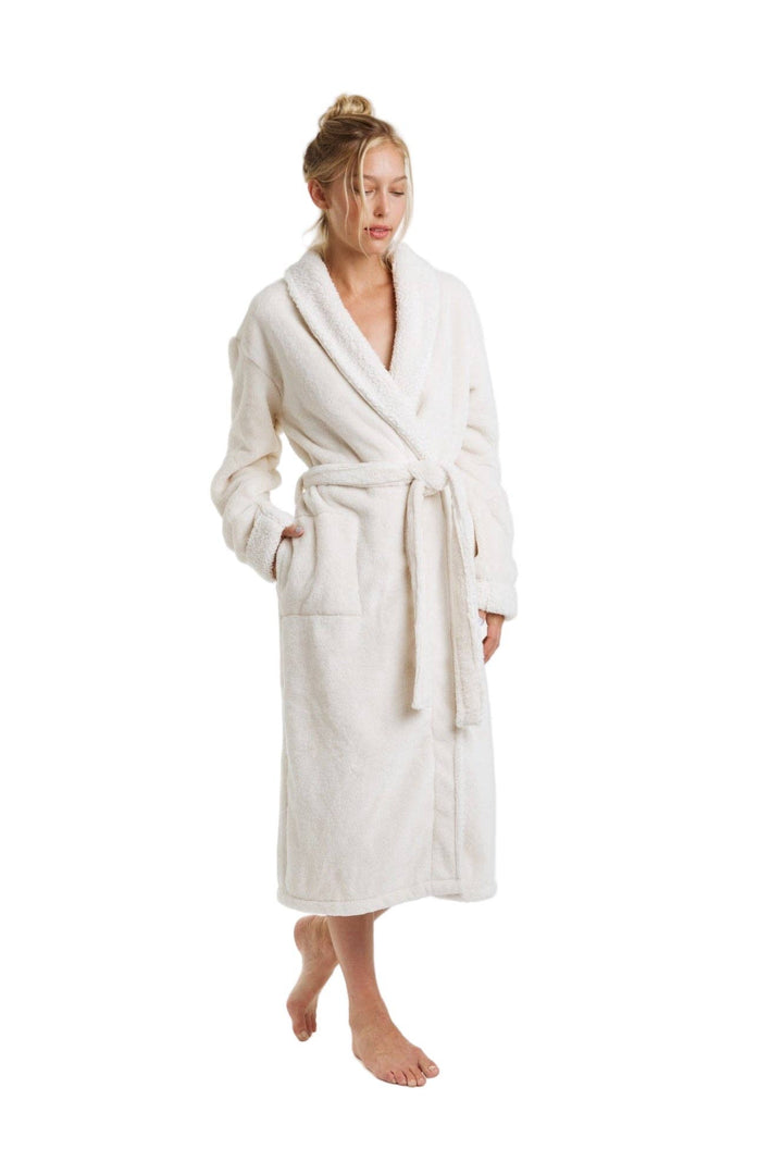 Woman wearing a white robe on a white background