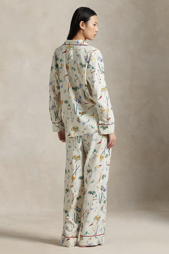 Person wearing a ski pajama set against a neutral background