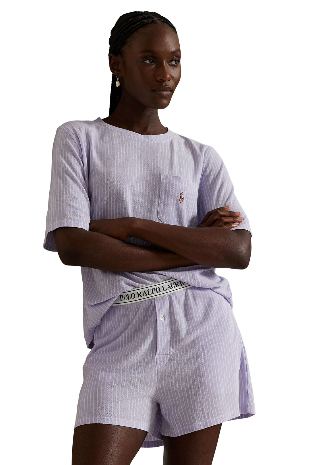 Woman wearing a striped outfit with Ralph Lauren logo on a white background