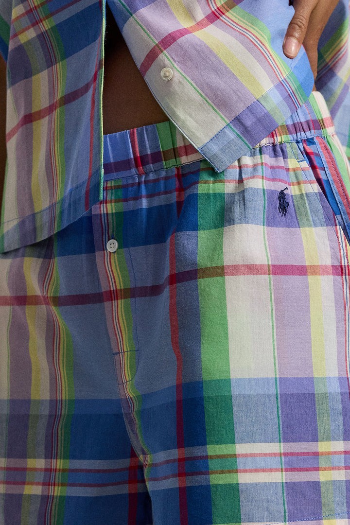 Multicolored plaid shirt with a visible polo ralph lauren brand logo on a person wearing it.
