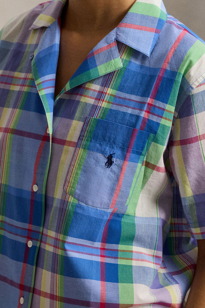 Multicolored plaid shirt with a small polo ralph lauren logo on a plain background