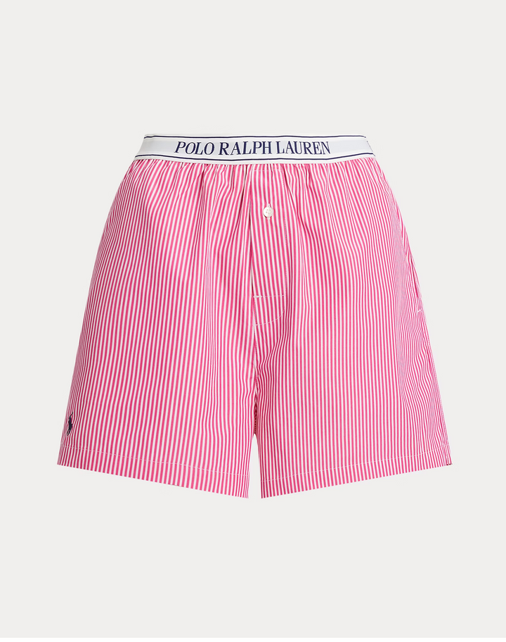 Pink and white striped boxer shorts with Polo Ralph Lauren waistband on a light gray background