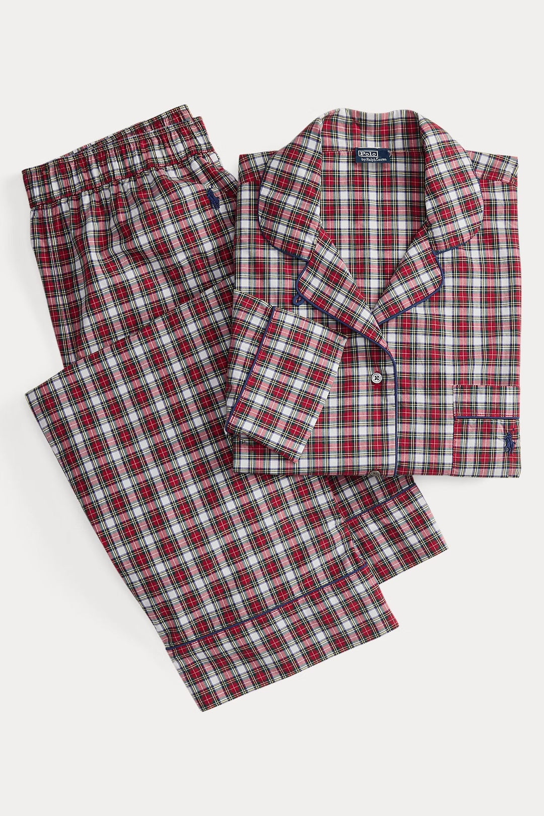 Red and green plaid pajama set on a white background