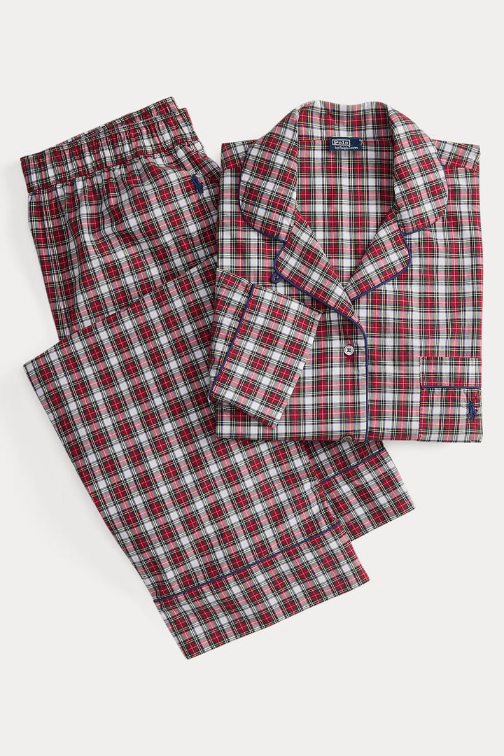 Red and green plaid pajama set on a white background