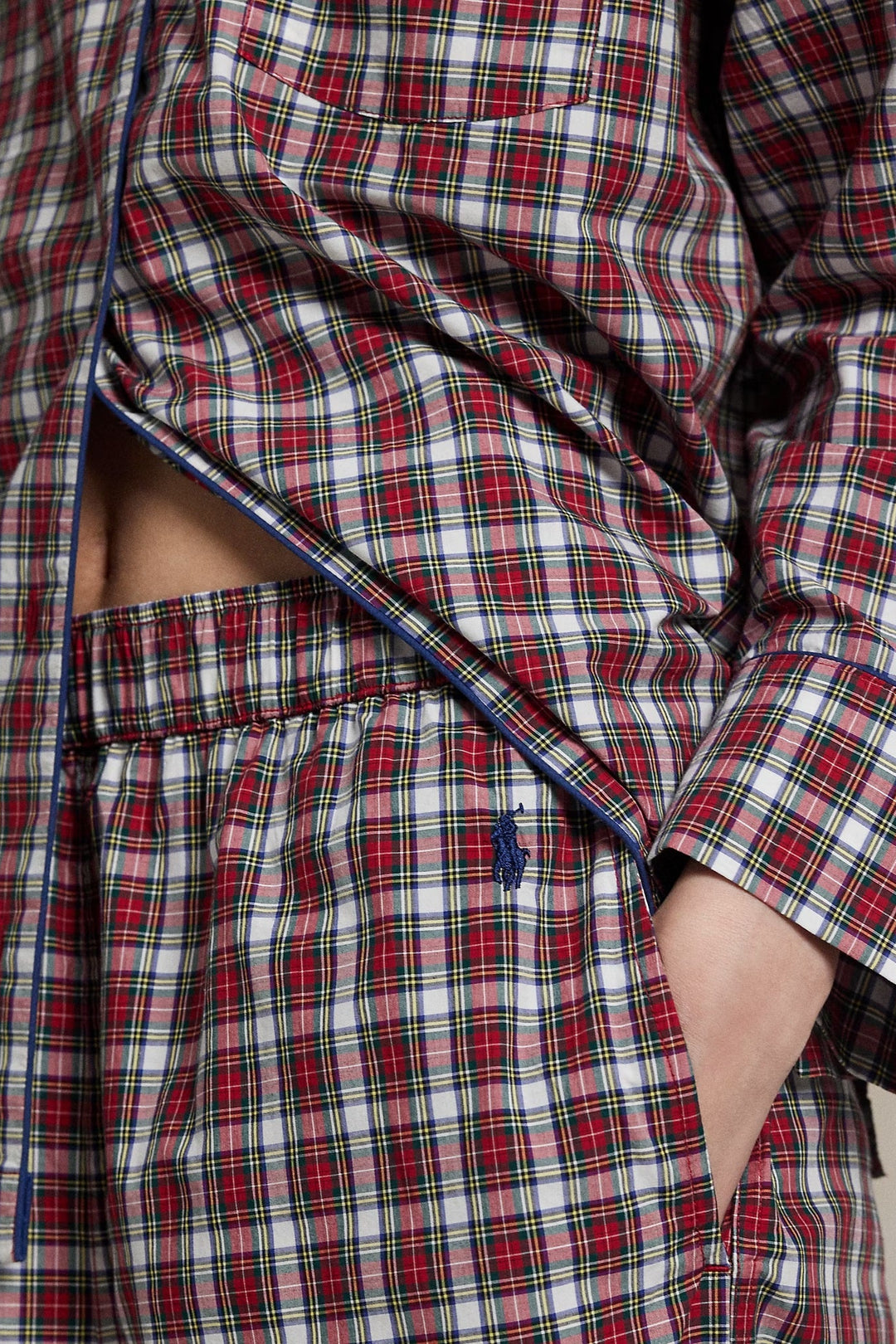 Red and white plaid pajama set with a visible brand logo on a neutral background