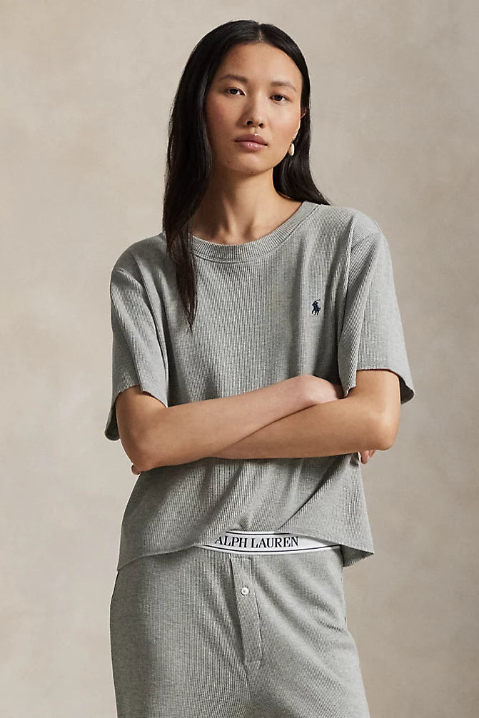 model wearing waffle knit grey heather relaxed-fit short sleeve tee with wide leg pant featuring Polo Ralph Lauren elastic waistband. 