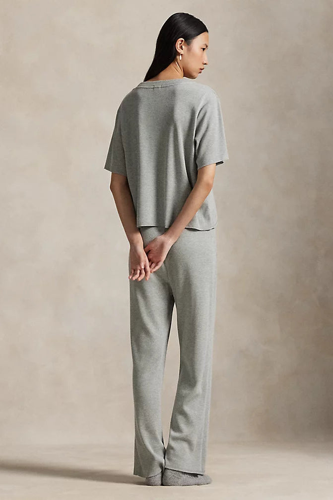 model wearing waffle knit grey heather relaxed-fit short sleeve tee with wide leg pant featuring Polo Ralph Lauren elastic waistband. 