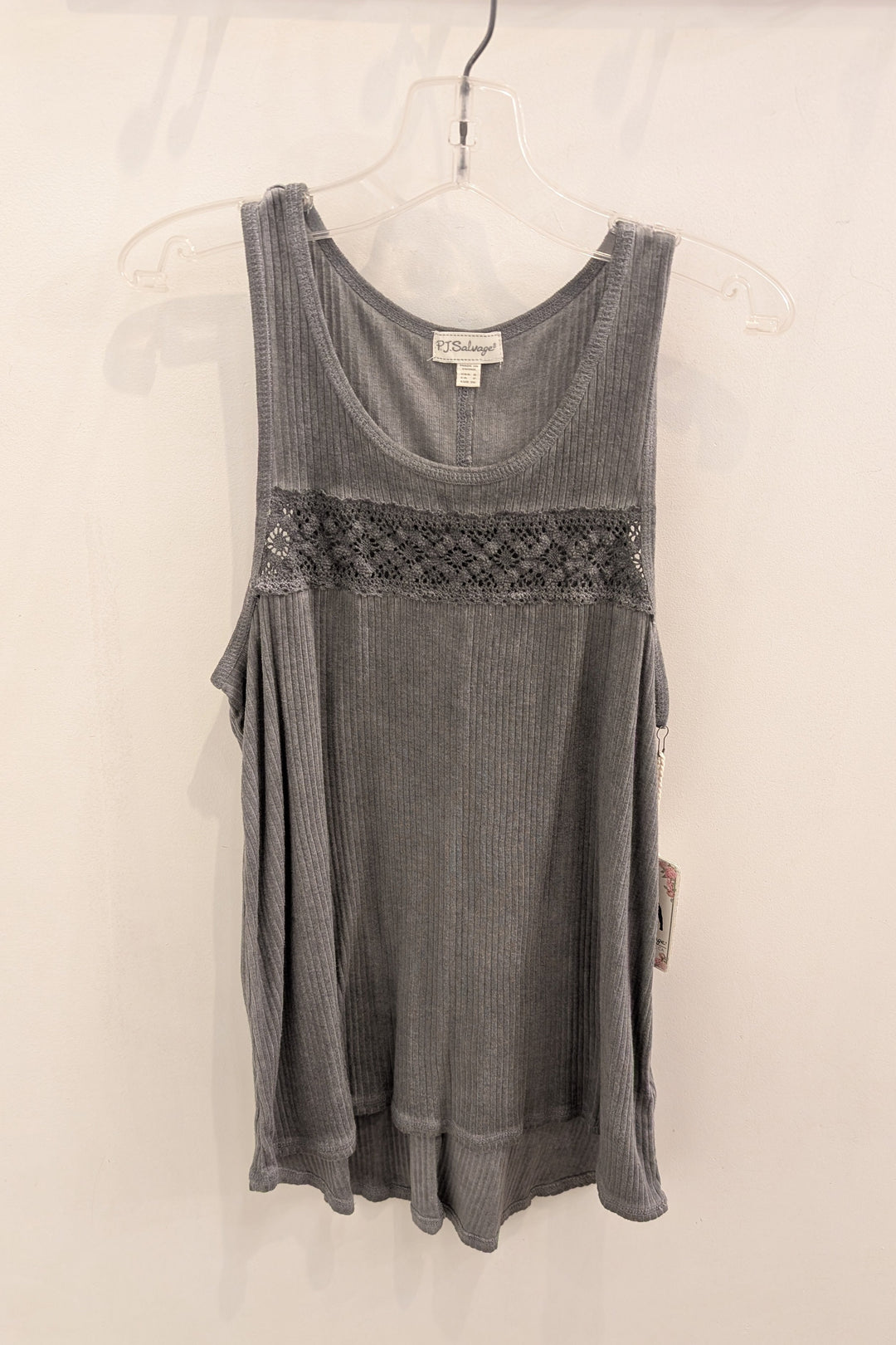 Gray tank top with lace detail on a hanger against a white background