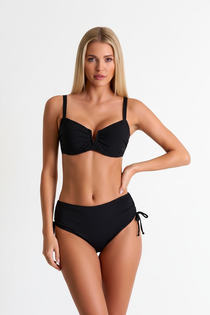 Woman wearing a classic black bikini with a padded top and high bottoms