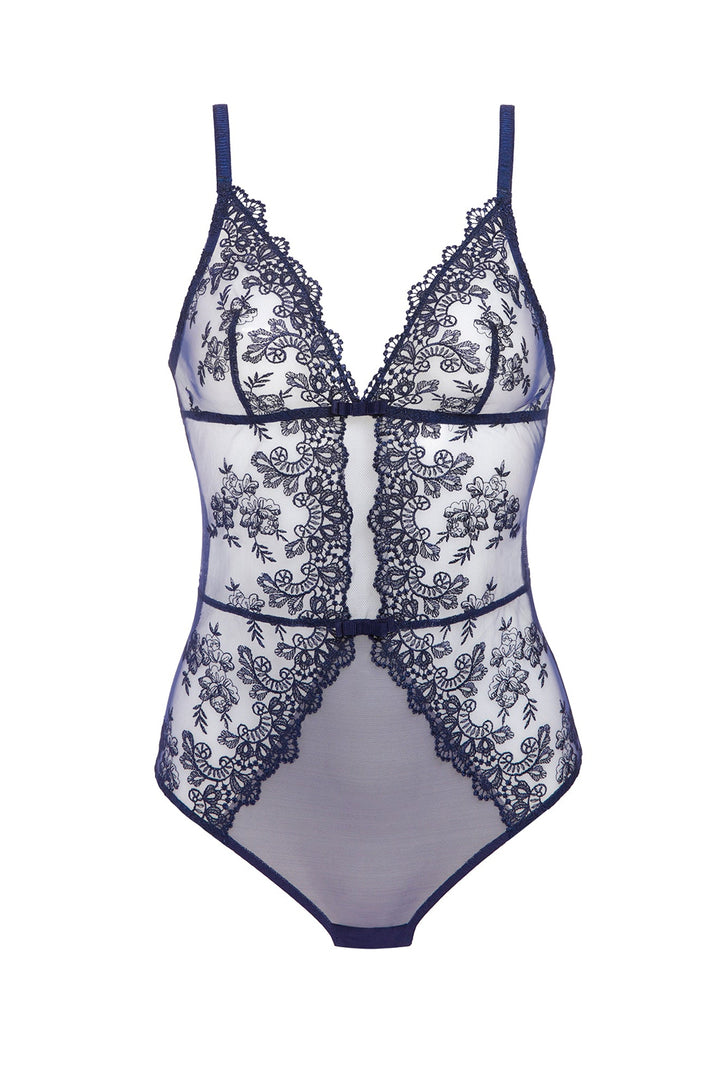 A sheer white mesh bodysuit with intricate navy blue floral lace applique and matching trim, featuring thin shoulder straps and a V-neckline, shown against a plain white background.