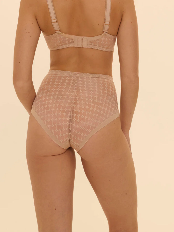 Beige shapewear set on a beige background