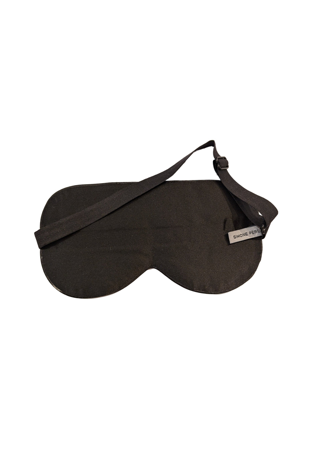 Black sleep mask back on a beige background