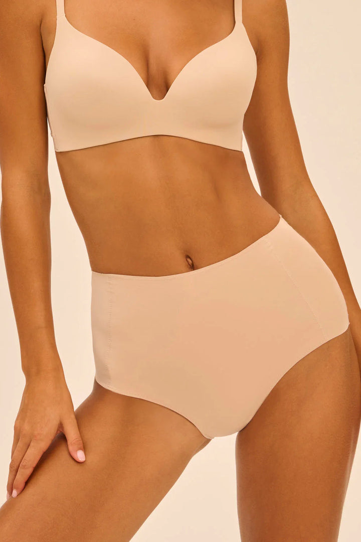 Beige shapewear set on a beige background