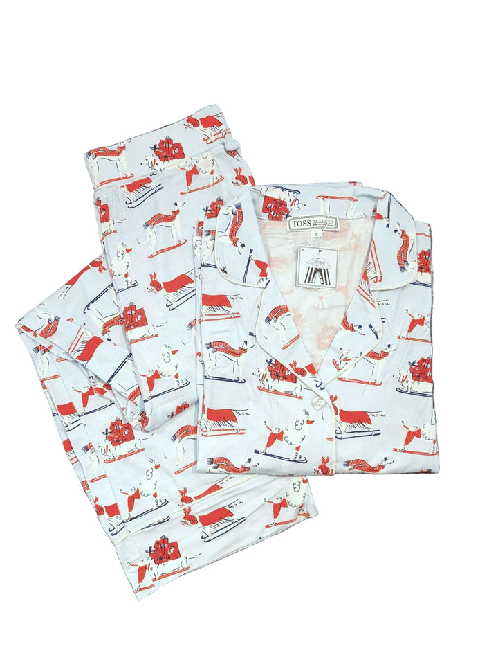 Set of red and white patterned fabric pajama with dogs on a white background