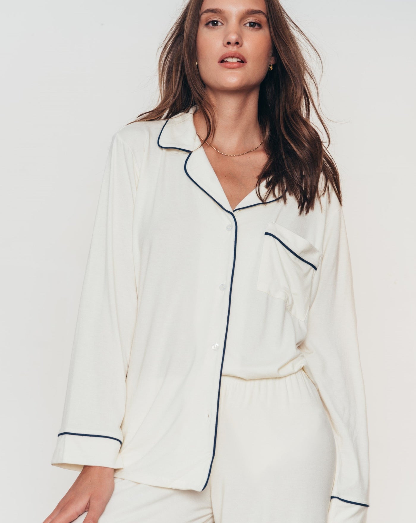 Classic long sleeve luxury pajama set with button front, collar and contrast piping in soft and comfortable ivory modal jersey.